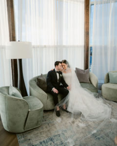 the lighthouse suite, bride and groom on the sofa