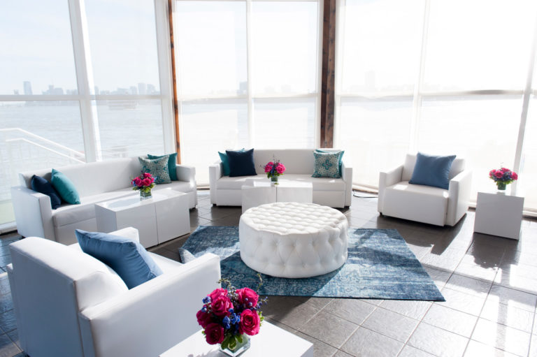 white sofas in The lighthouse with colorful pillows