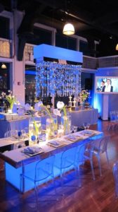Mitzvah Table Set up decor in a white and blue theme with hanging chandeliers