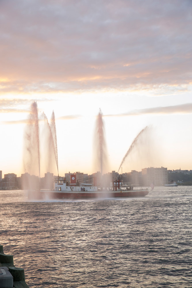 Rescue boat on the hudson river spraying water into the air