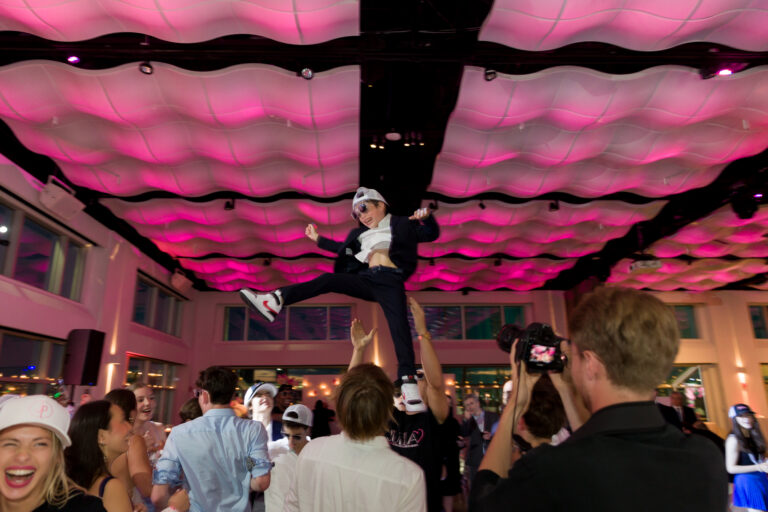 Flying in the air at a White and Pink Bat Mitzvah at Current, Pier 59 - The Pier Sixty Collection