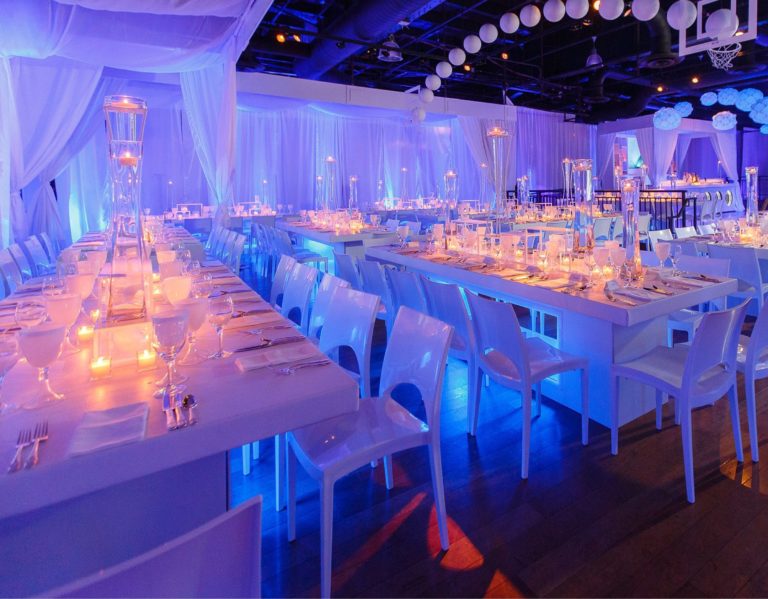 Blue and purple mood-lit dinner tables
