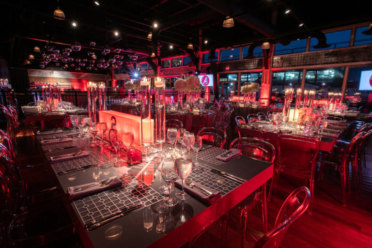 Tables set for Mitzvah with red lighting