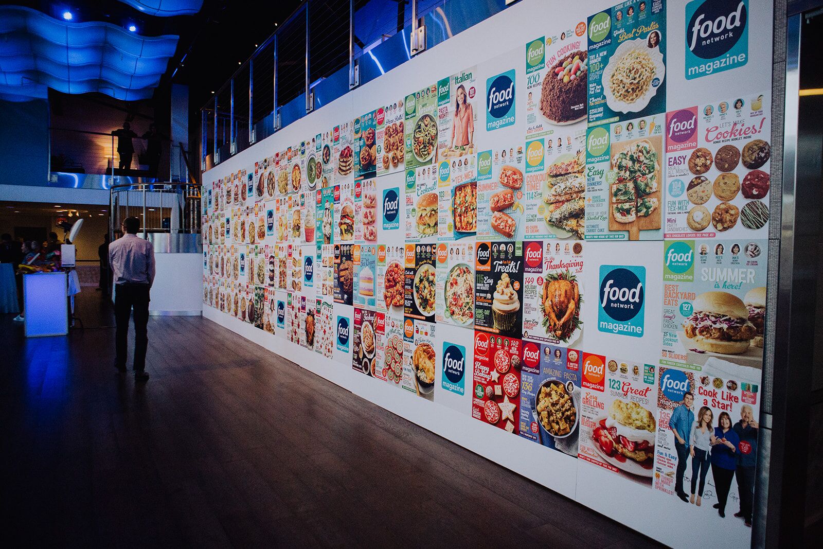 Long wall covered in Food Network magazine covers.