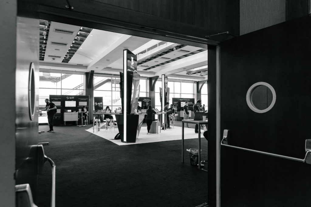 black and white picture taken from the foyer into Majestic where there exhibit booths