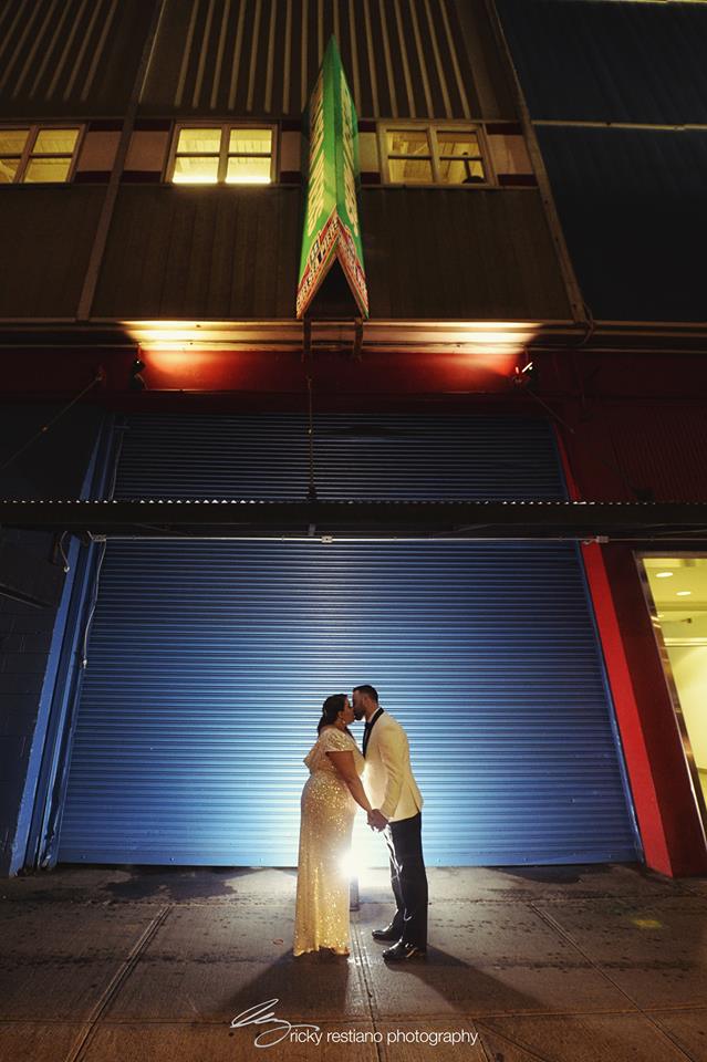 bride and groom kissing outside in Chelsea Piers