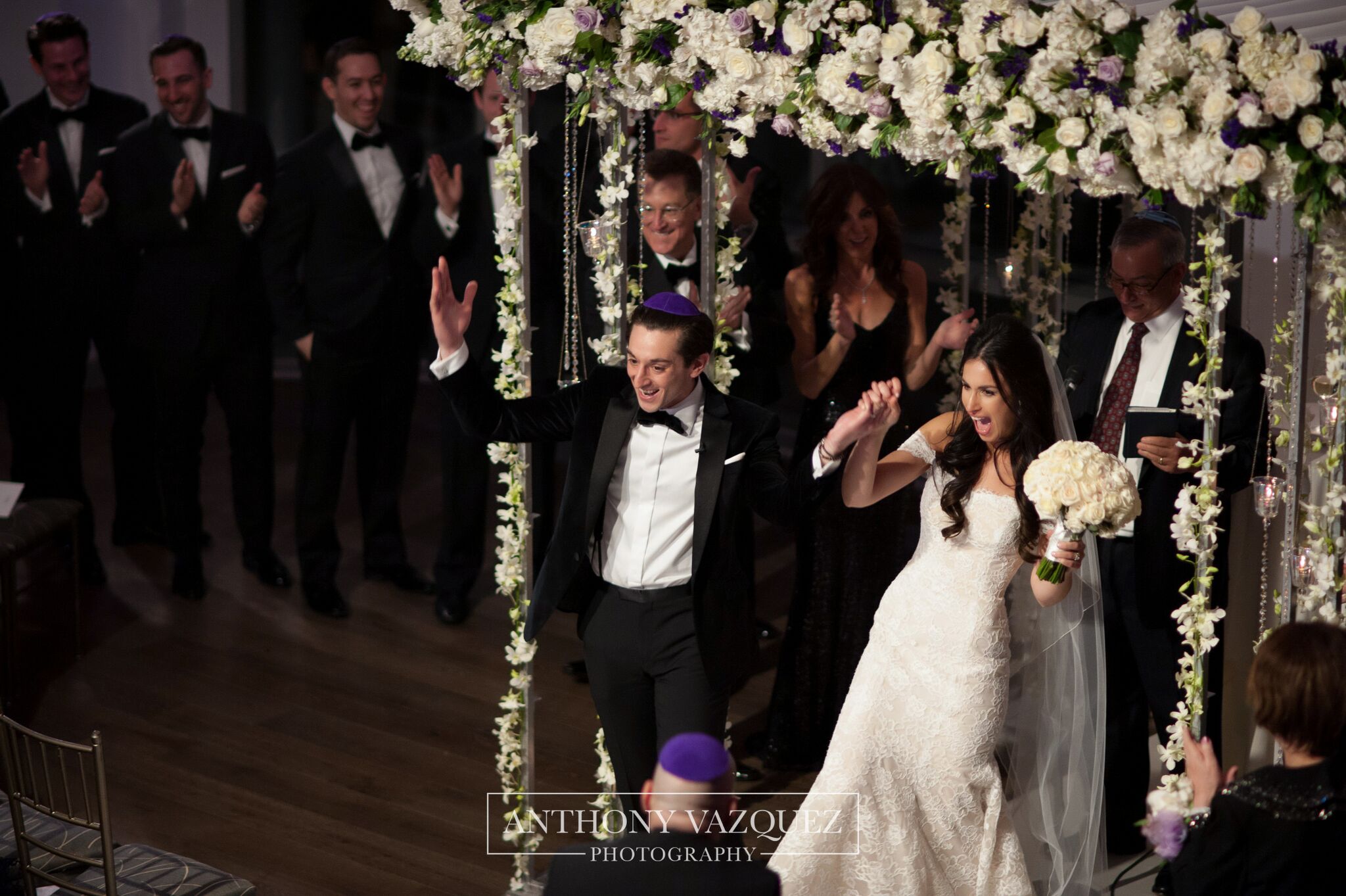 bride and groom celebrating saying I DO by the Chuppah at Current