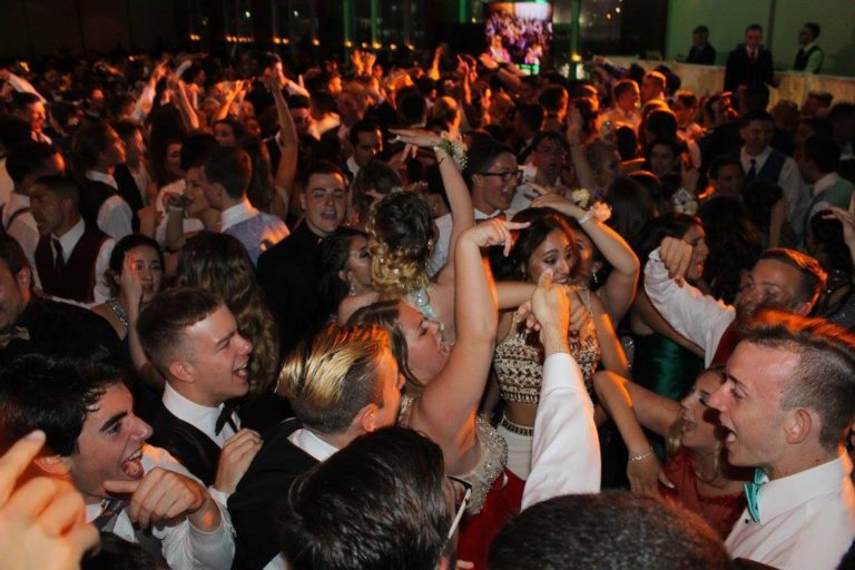 dancefloor packed with young adults for a prom at pier sixty