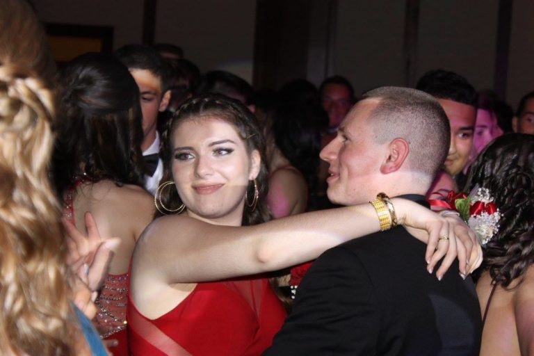 two young adults dancing at a prom at pier sixty