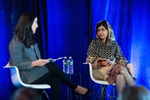 Malala Yousafzai on stage at a meeting at The Lighthouse