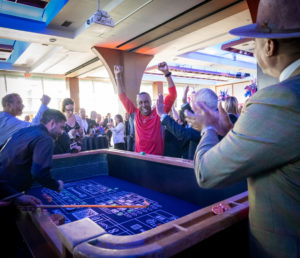 a Guests celebrating a big win at a Casino Night at Pier Sixty