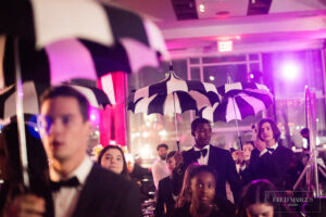 Models walking with umbrellas at a Mitzvah at Pier Sixty, The Pier Sixty Collection